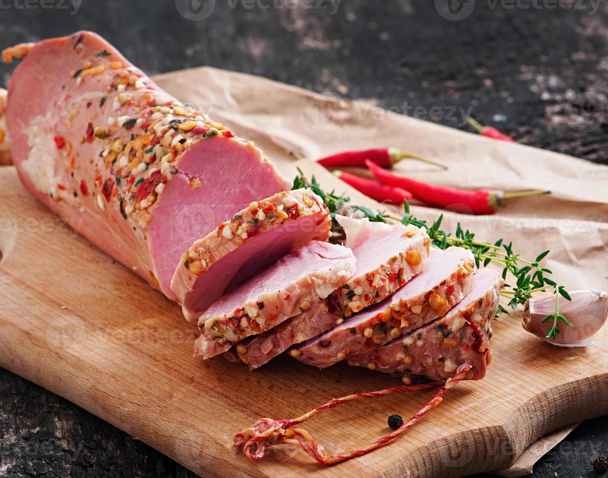 Slice of ham baked in spices photo