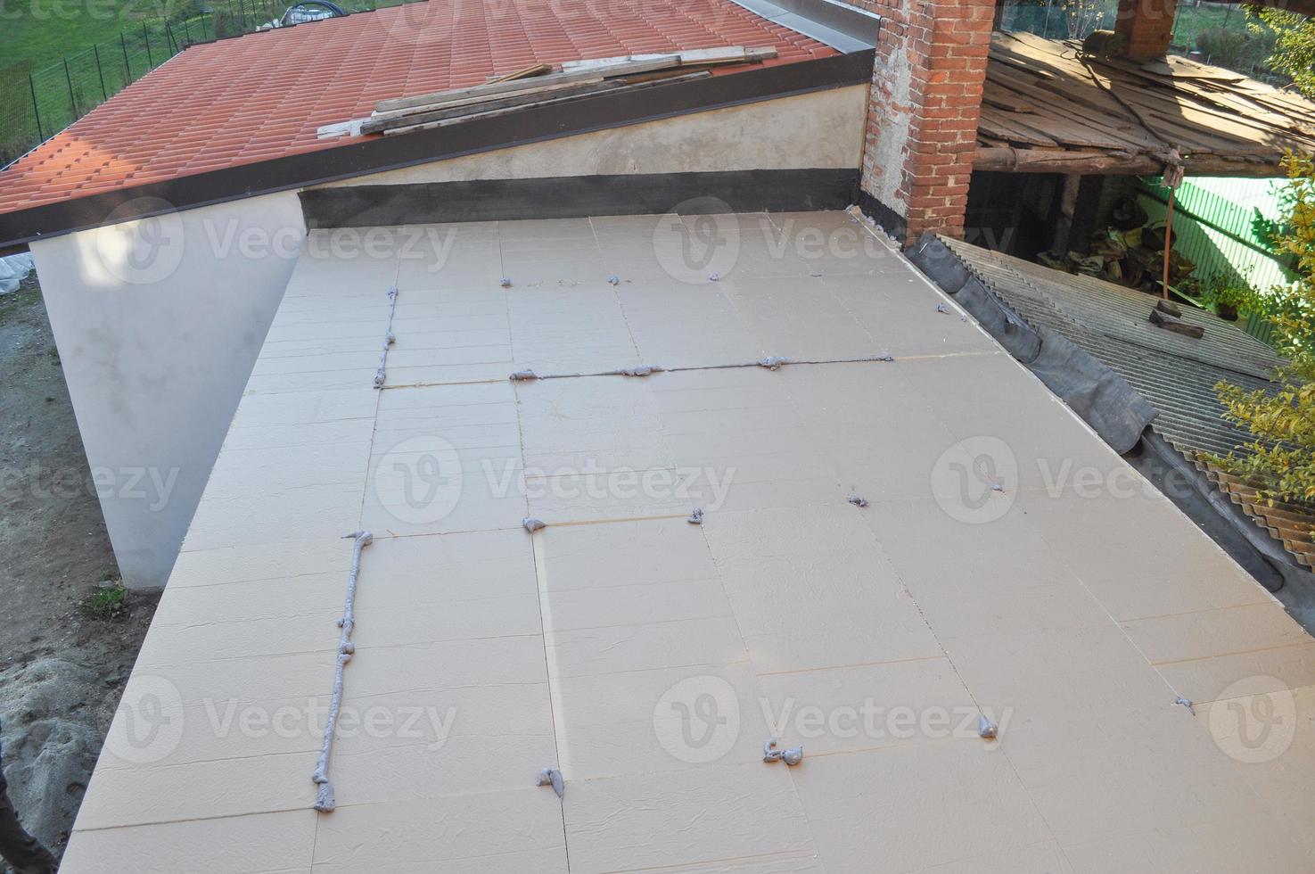 Thermal Insulation of flat roof with insulation boards photo