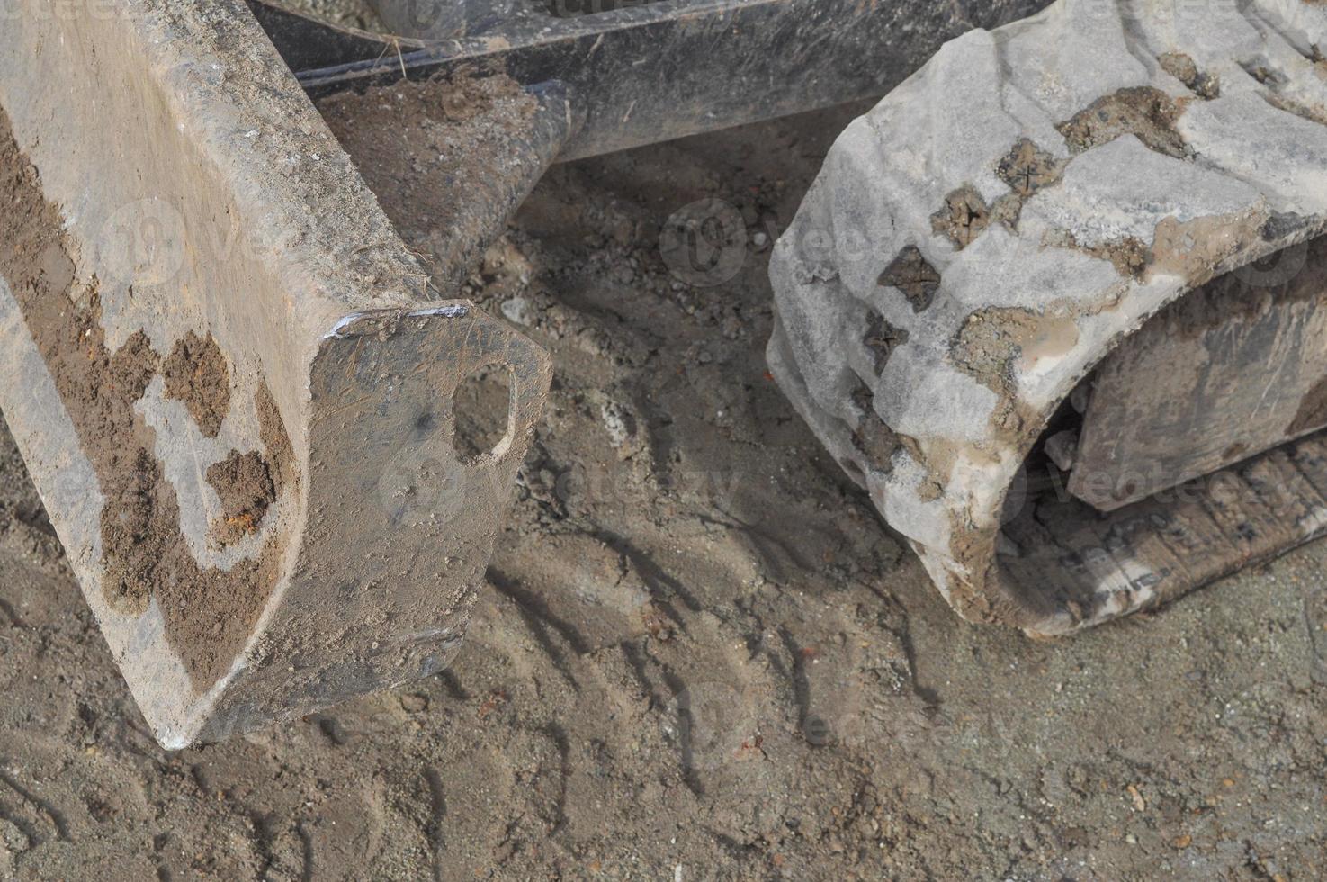 Excavator digging a hole photo