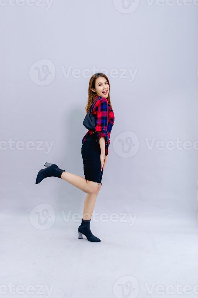 The young woman model stands happily with her shoot. Concept photo