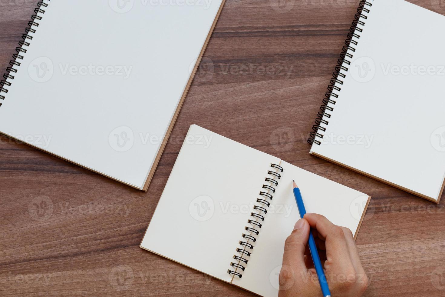 content marketing concept. top view of hand writing on open notebook, mockup for advertise content online. photo