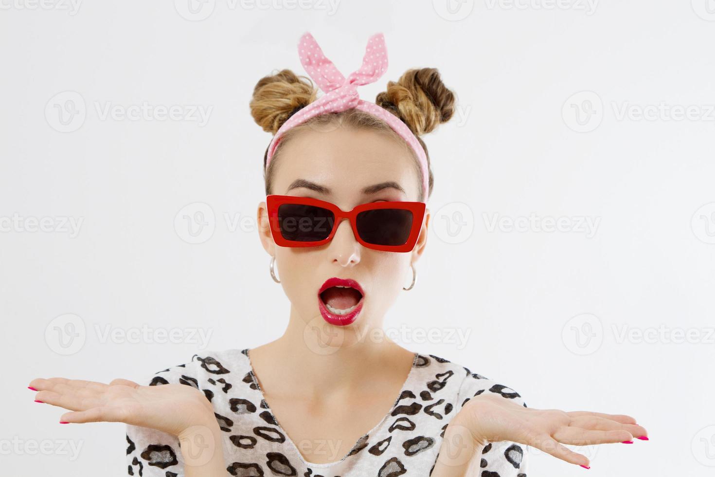 Happy woman face closeup. Summer fashion and accessories. Closeup female portrait in red sunglesses and colorful makeup. Isolated on white background. Copy space photo