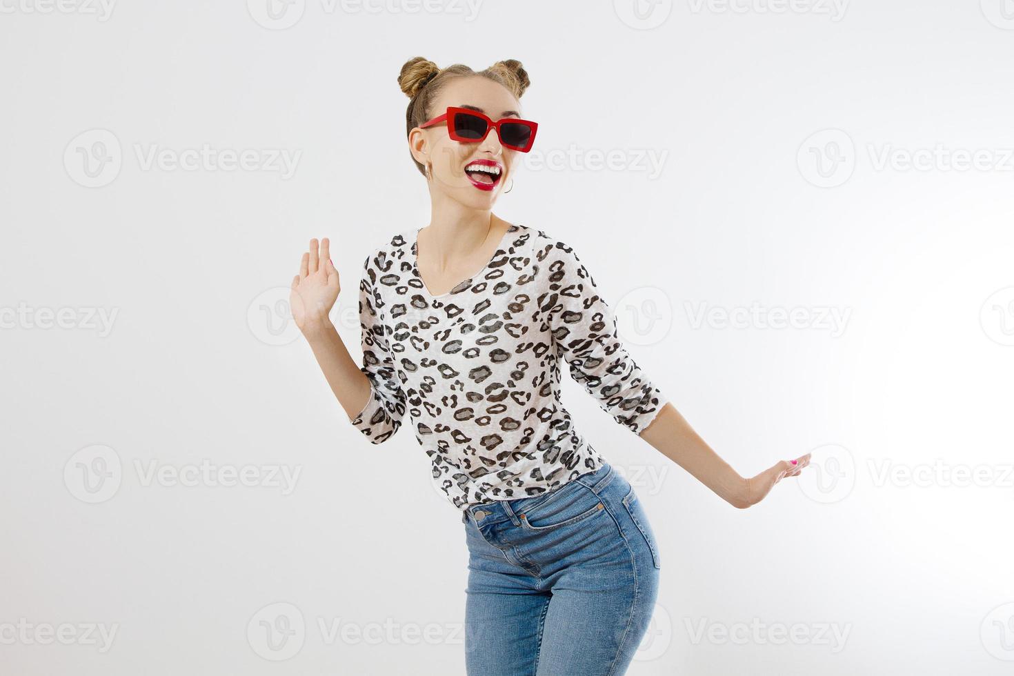 Happy woman isolated on white background. Summer fashion style. Red lipstick and sunglasses. Funny hairstyle and fun summertime. Shopping concept. photo