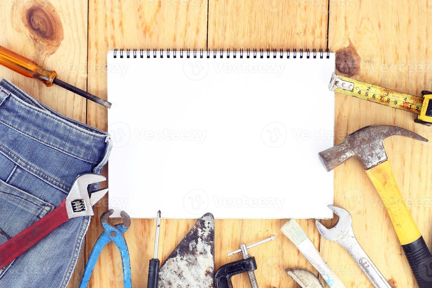 Happy Labour day. USA Labor day concept. International father's day - Top view many handy tools and open notebook on wooden background with copy space - flay lay photo