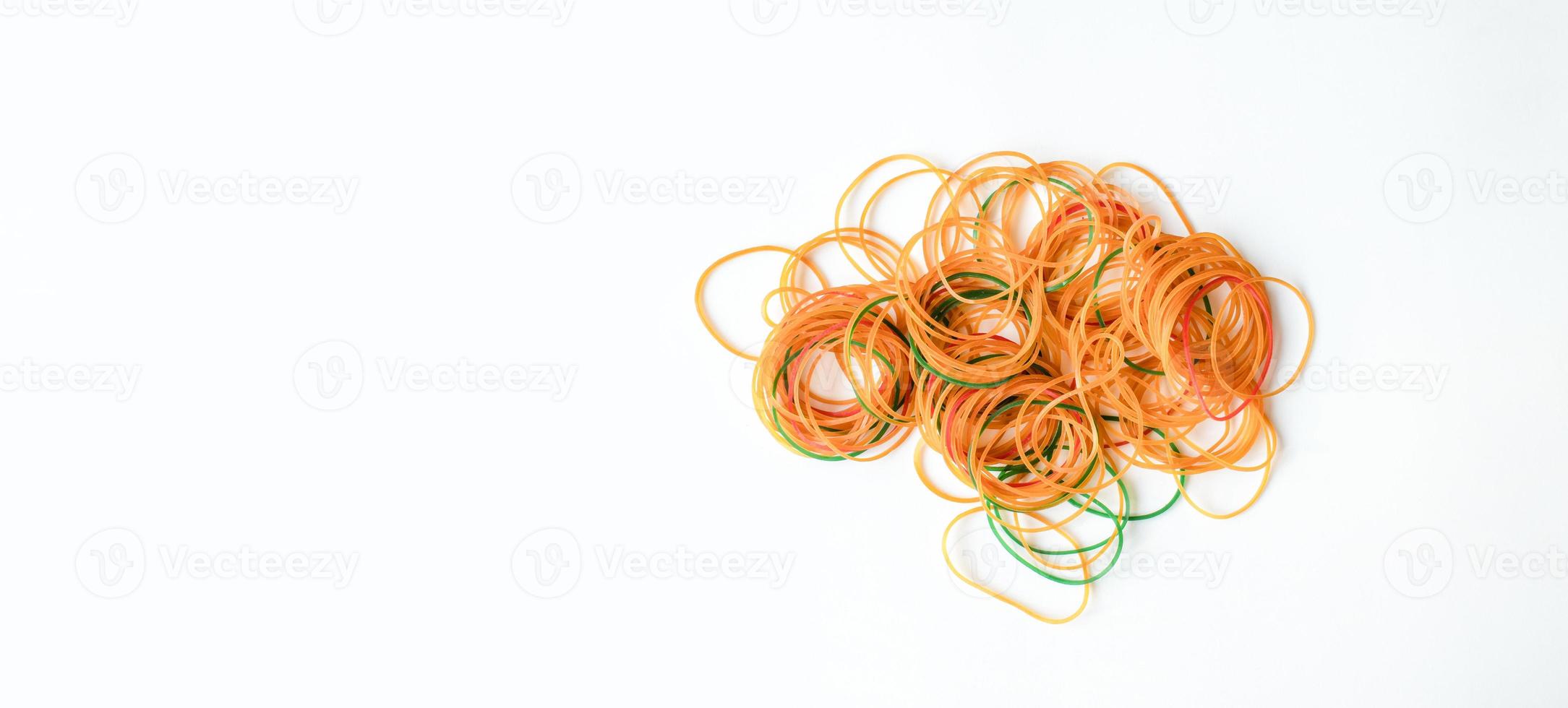 Closeup, The rubber bands have colorful the are available on a white background and copy space on the left hand for design and text. photo