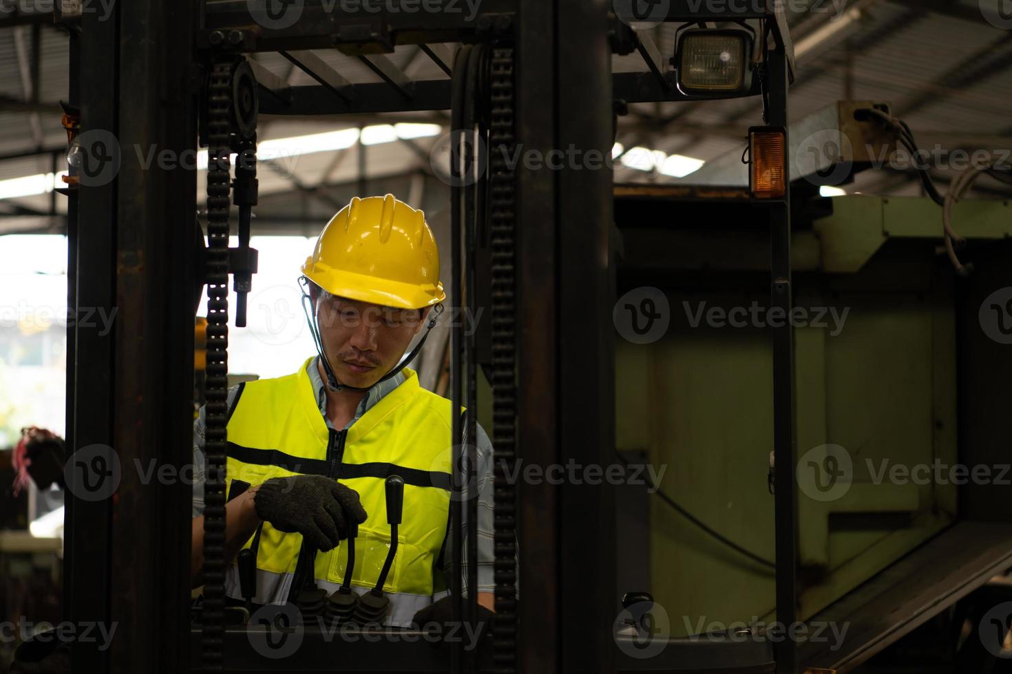 Forklift drivers are drowsy at work because of hard work and little rest. photo