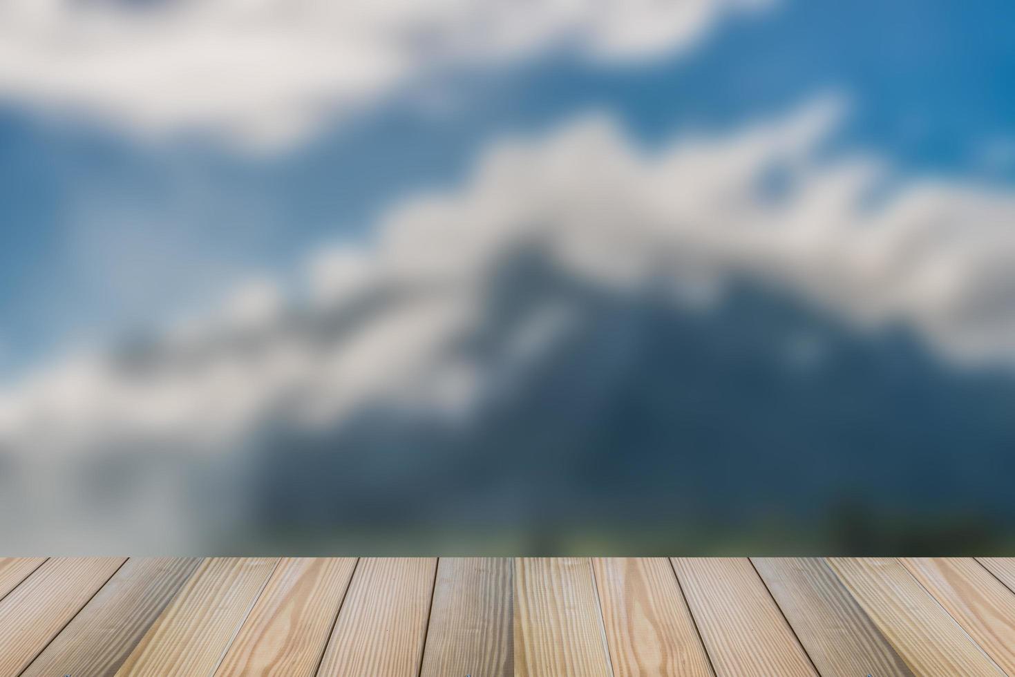 Wood floor with blurred nature background. photo