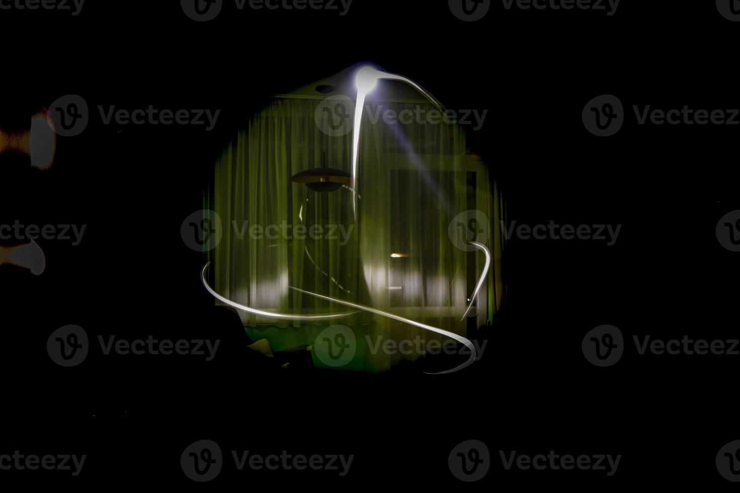 Abstract light painting long exposure shot with a strong flash light photo