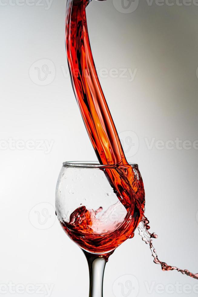 Wine splash into glass photo