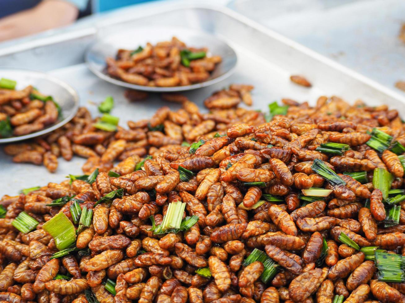 Close-up of fried bamboo worms in market photo