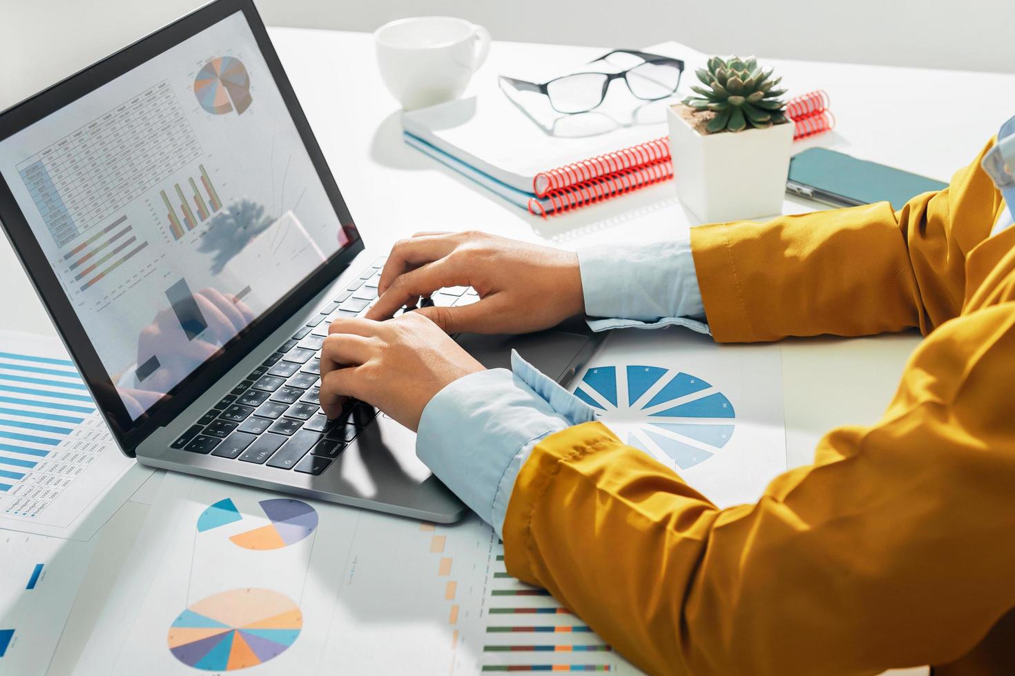 accountant using laptop computer on desk in office. business accounting concept photo