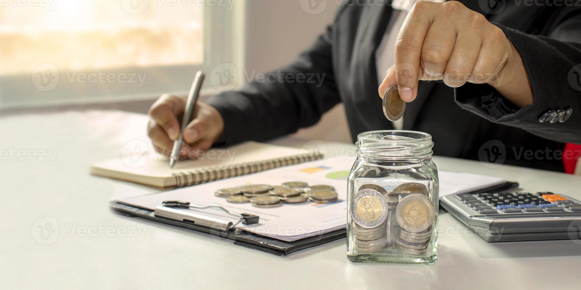 Working men aged 25-60, put coins in a glass jar to save money. Retirement Financial Planning Ideas Save money and cash. Finance. Invest. Managing business growth. photo