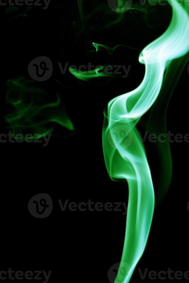 Green smoke on black background photo