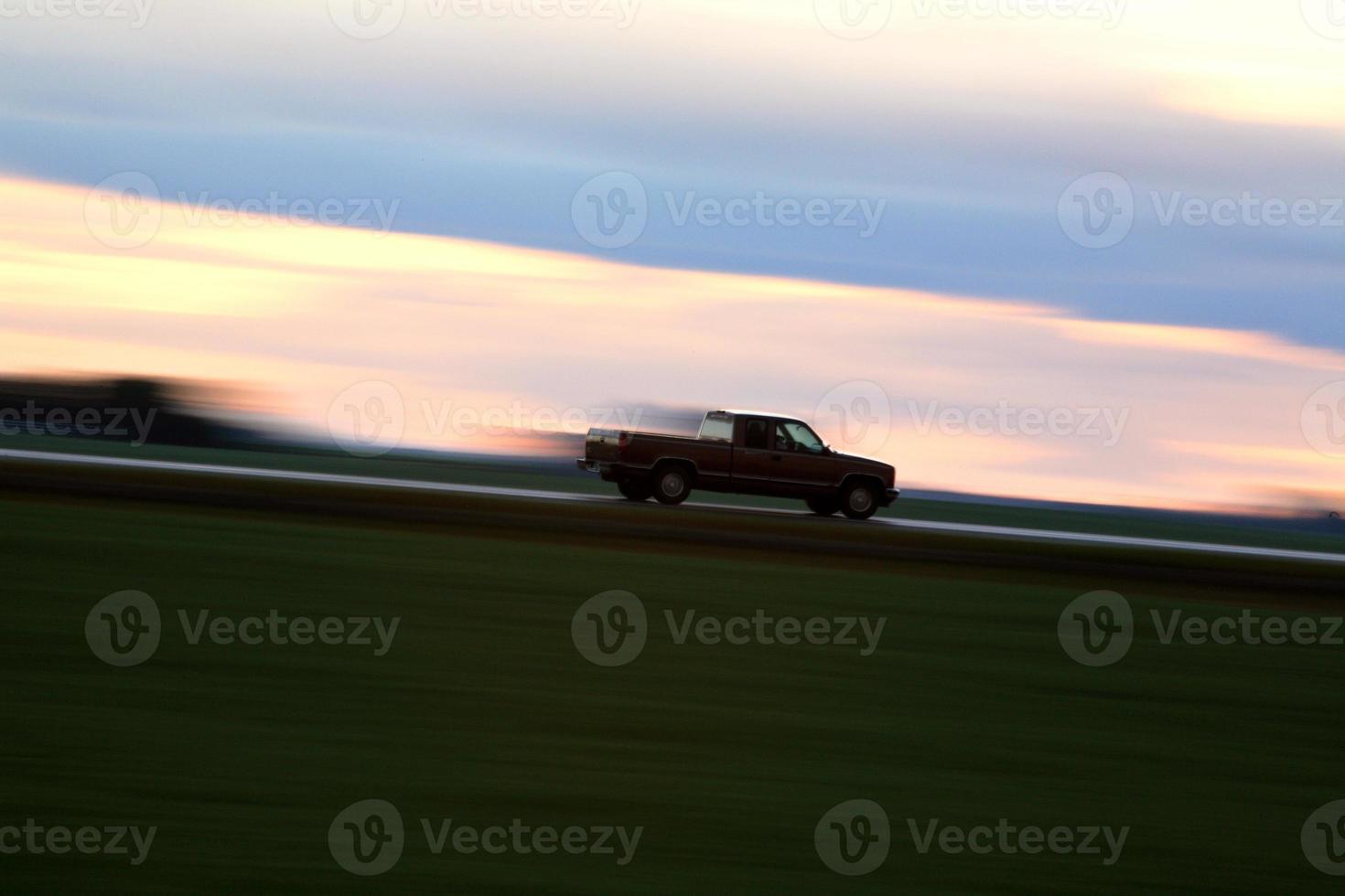 Speeding car along a Saskatchewan highway photo