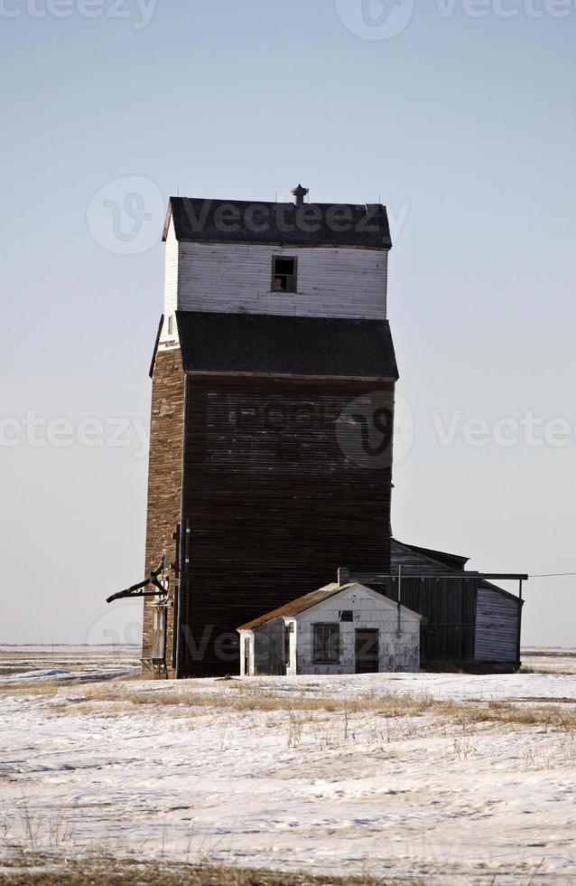 Old wooden grain elevator in winter photo