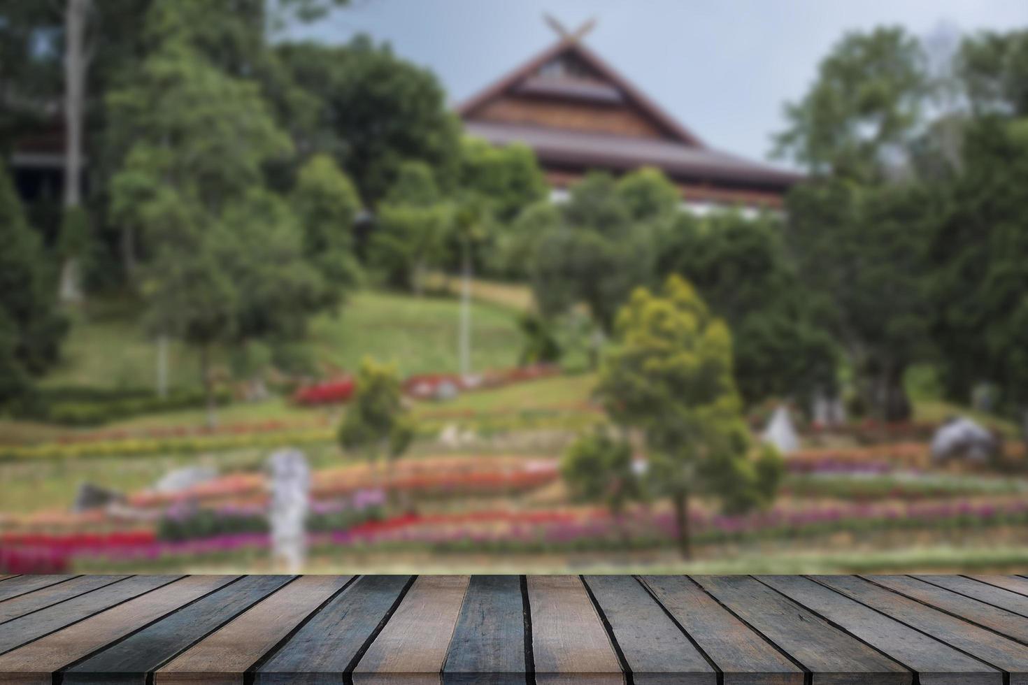 wooden table top on blurred park background photo