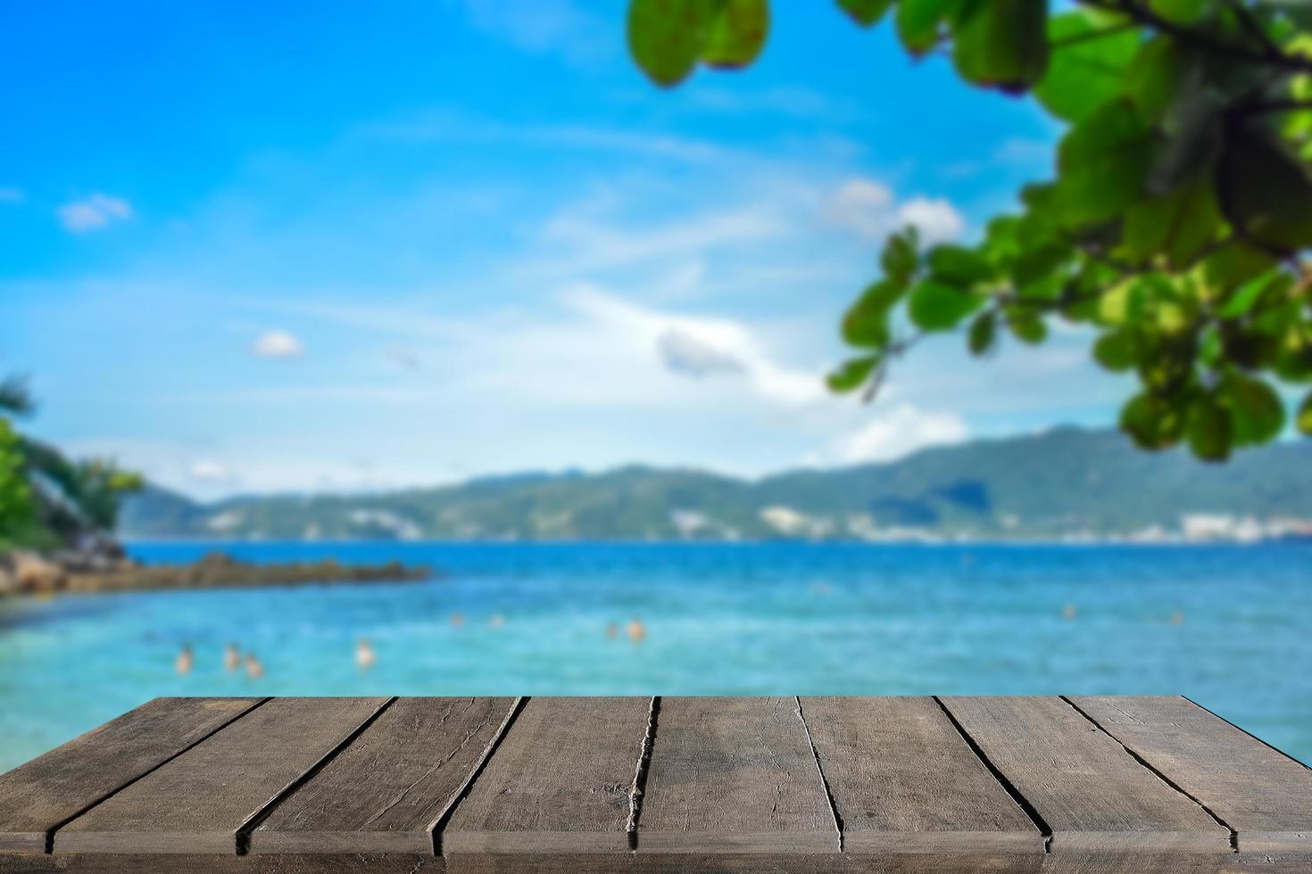 Wooden table tops on the sea floor in the hazy daylight. photo