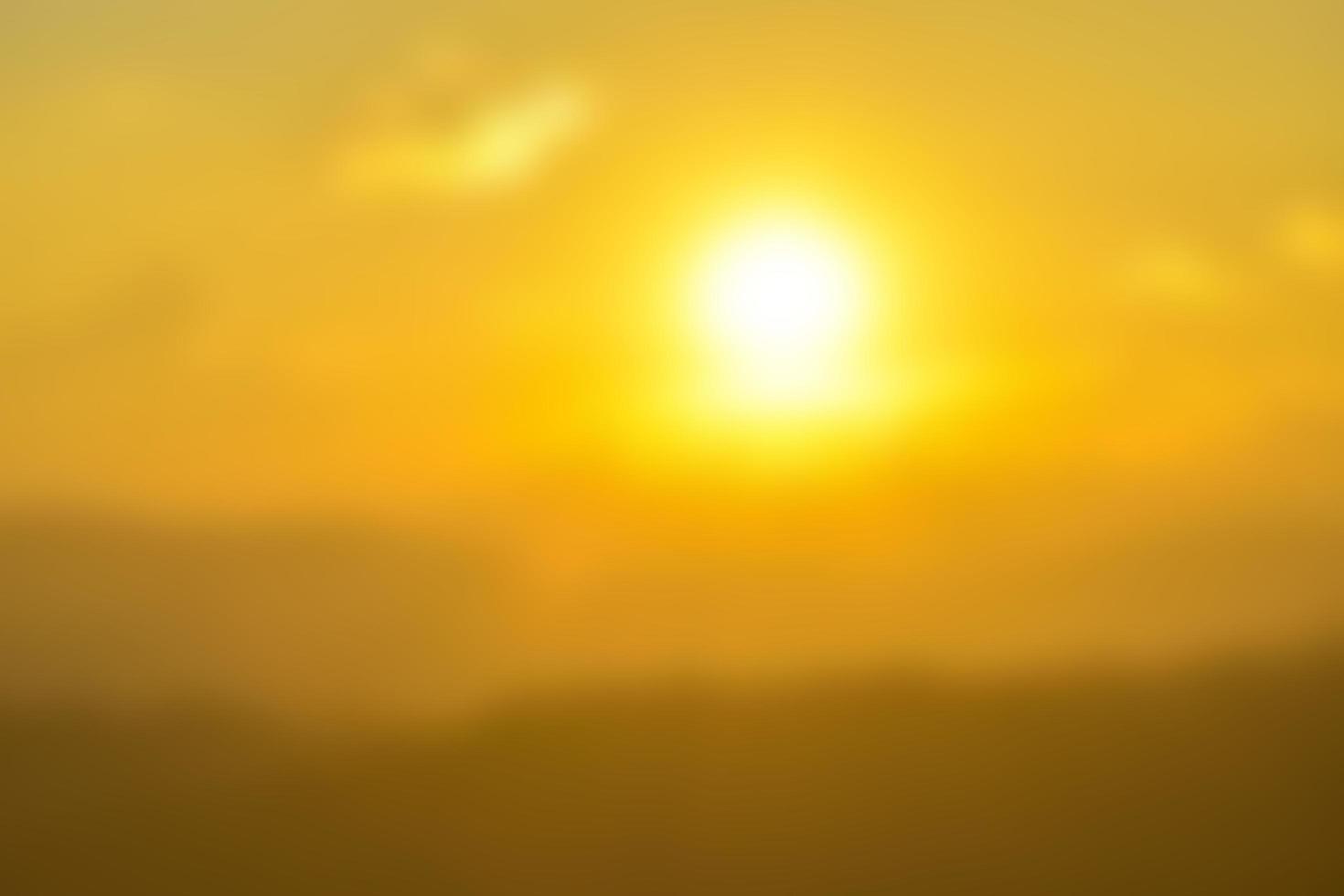 The blurred view of the mountains against the beautiful backdrop of the colored sky and clouds. photo