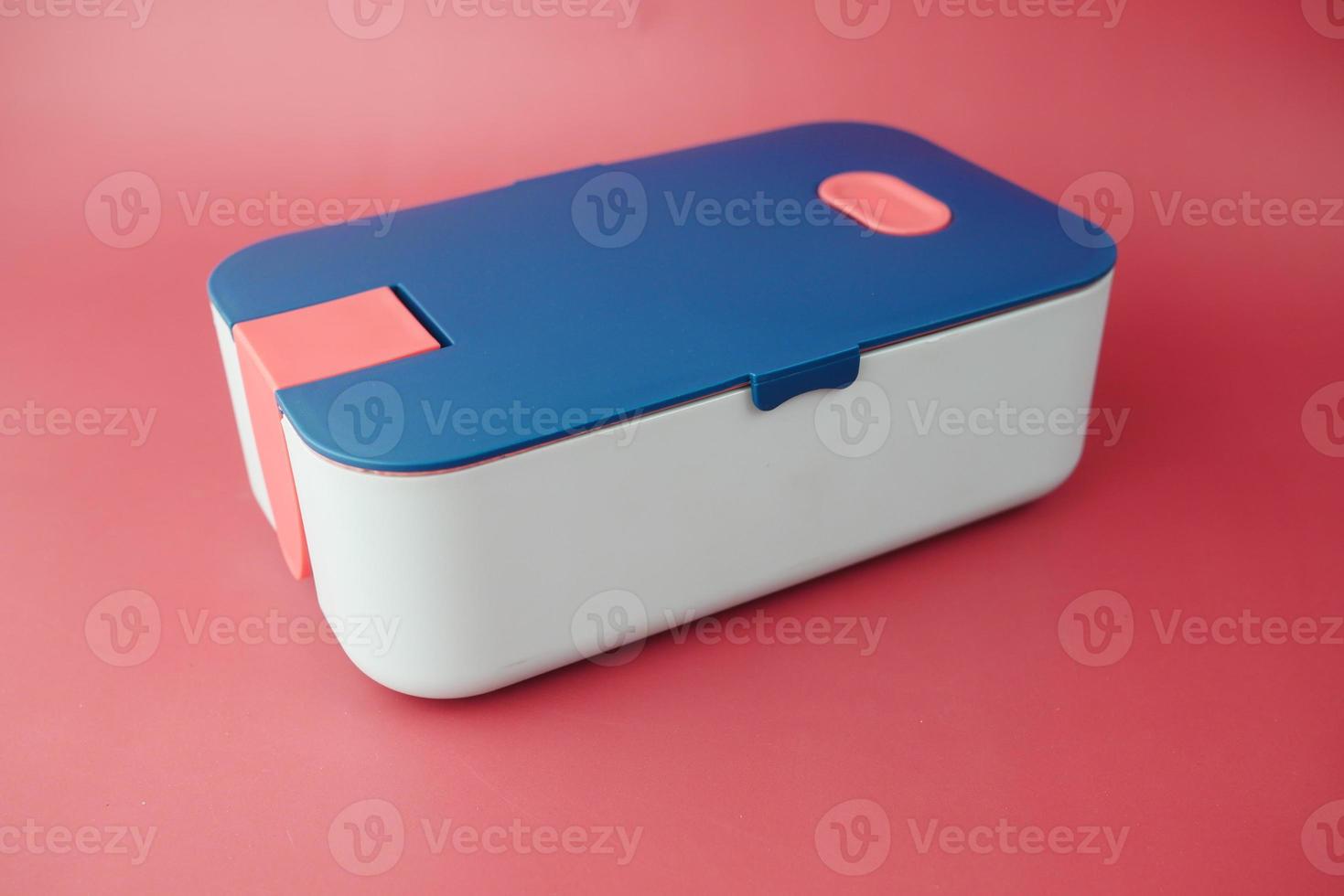 top view of a lunch box on color background photo