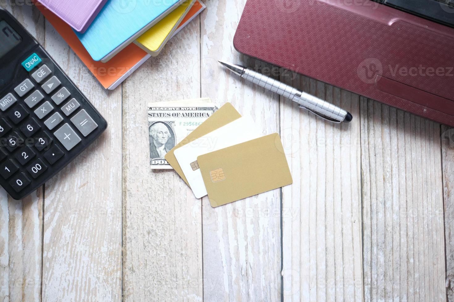 high angle view of credit cards on laptop on table photo