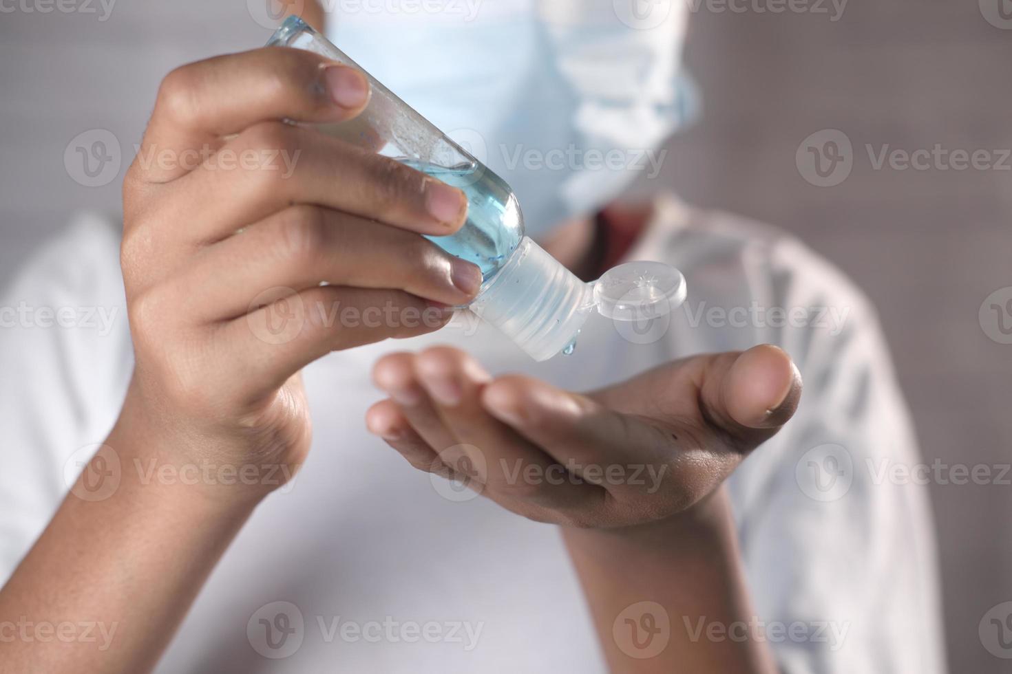 Using sanitizer liquid for preventing corona virus photo