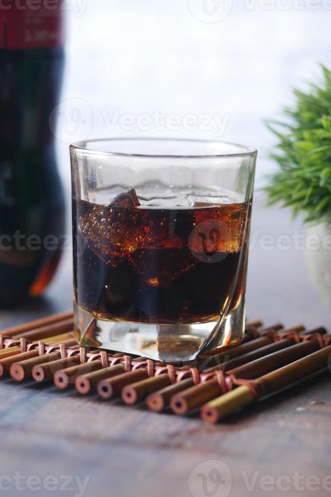 cold soft drinks with ice on table photo