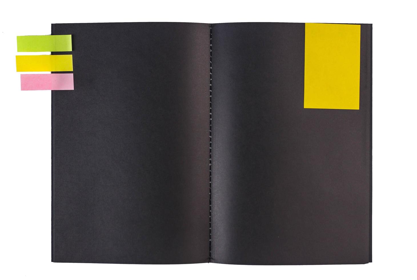 Blank black notebook and colorful notepaper photo