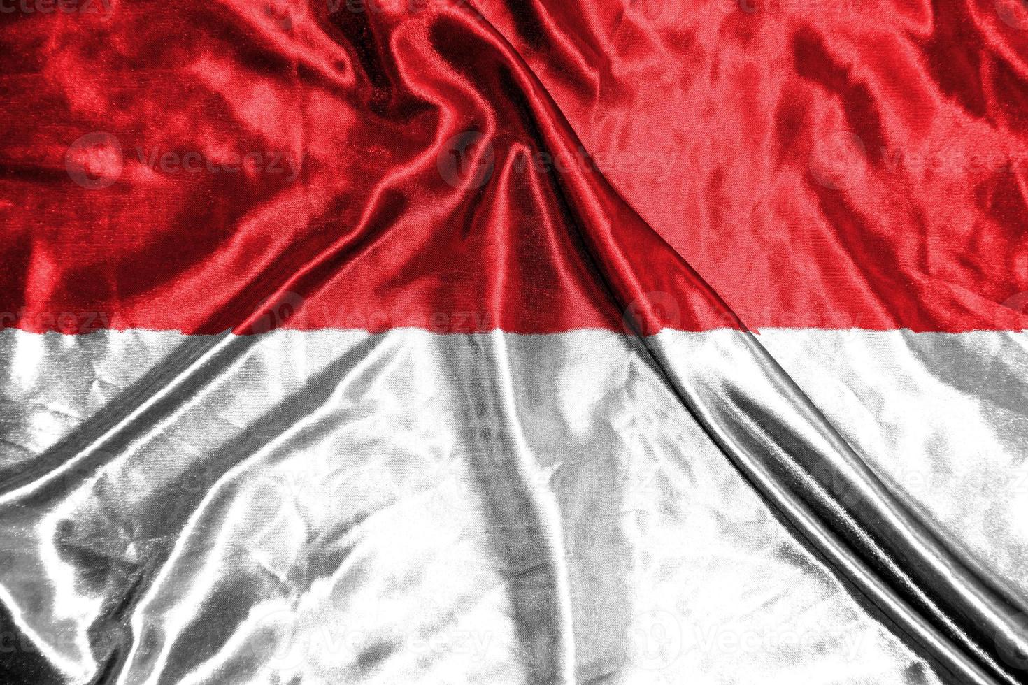 bandera de tela de indonesia bandera de satén ondeando la textura de la tela de la bandera foto