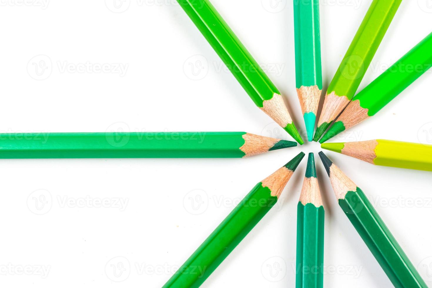 Multi-colored wooden sticks Wooden colouring pencils on white background photo