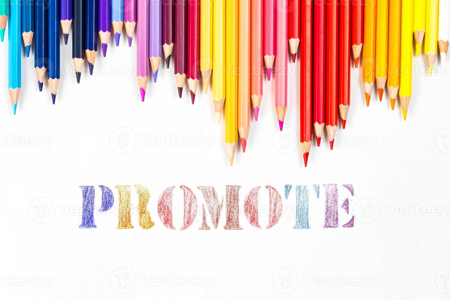 Multi-colored wooden sticks Wooden colouring pencils and Promote on white background photo