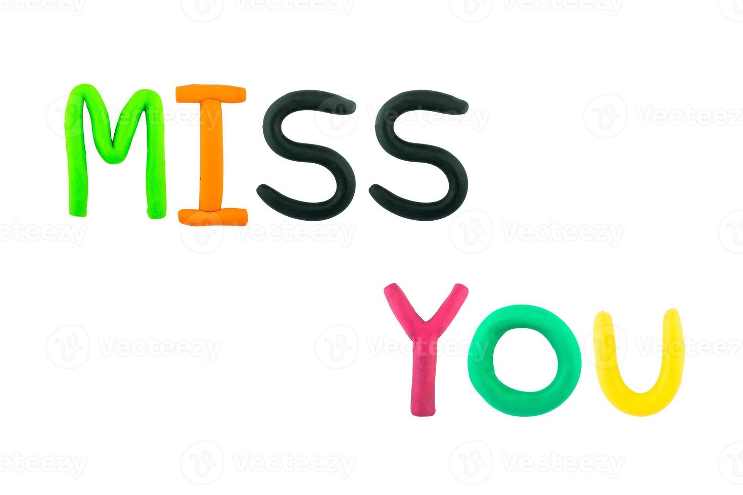 message miss you Funny plasticine alphabet letters on white background photo