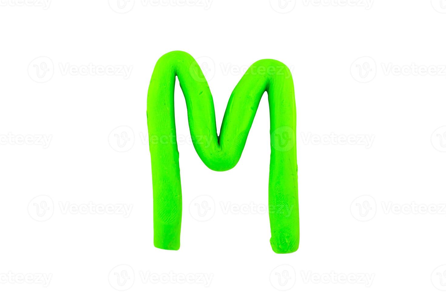 alphabet M English colorful letters Handmade letters molded from plasticine clay on Isolated white background photo