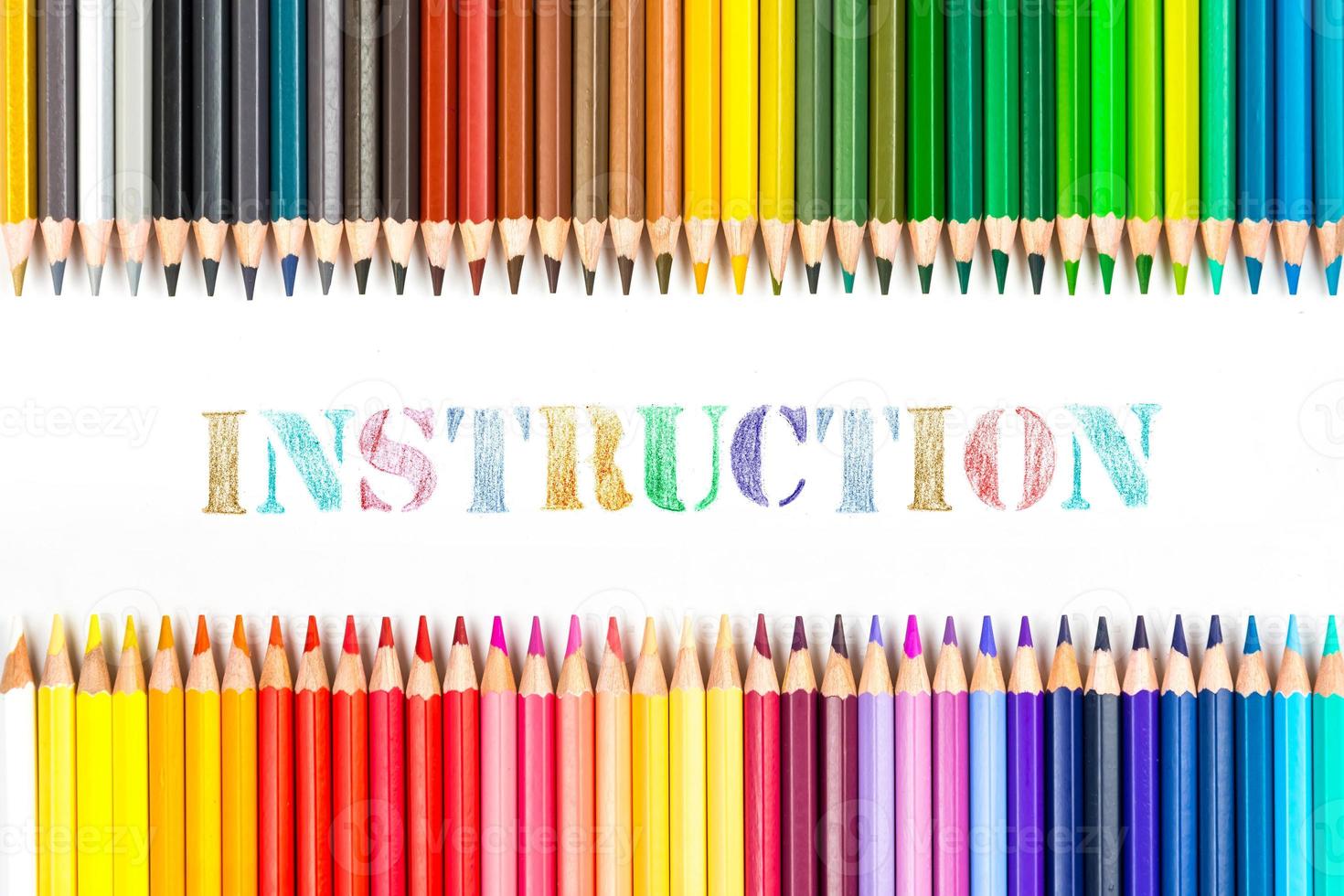 Multi-colored wooden sticks Wooden colouring pencils and Instruction on white background photo