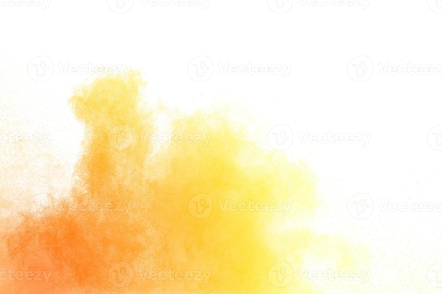 Abstract yellow powder explosion white on  background. Yellow dust particle splashing. photo
