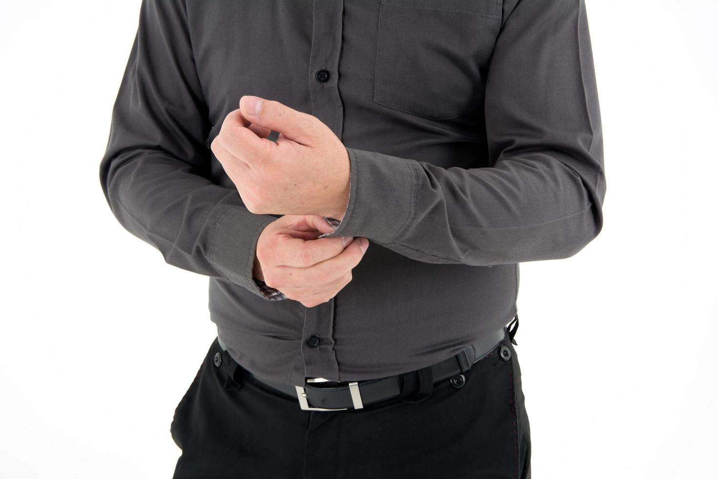 Hand organizing sleeve of shirt isolated on white background photo