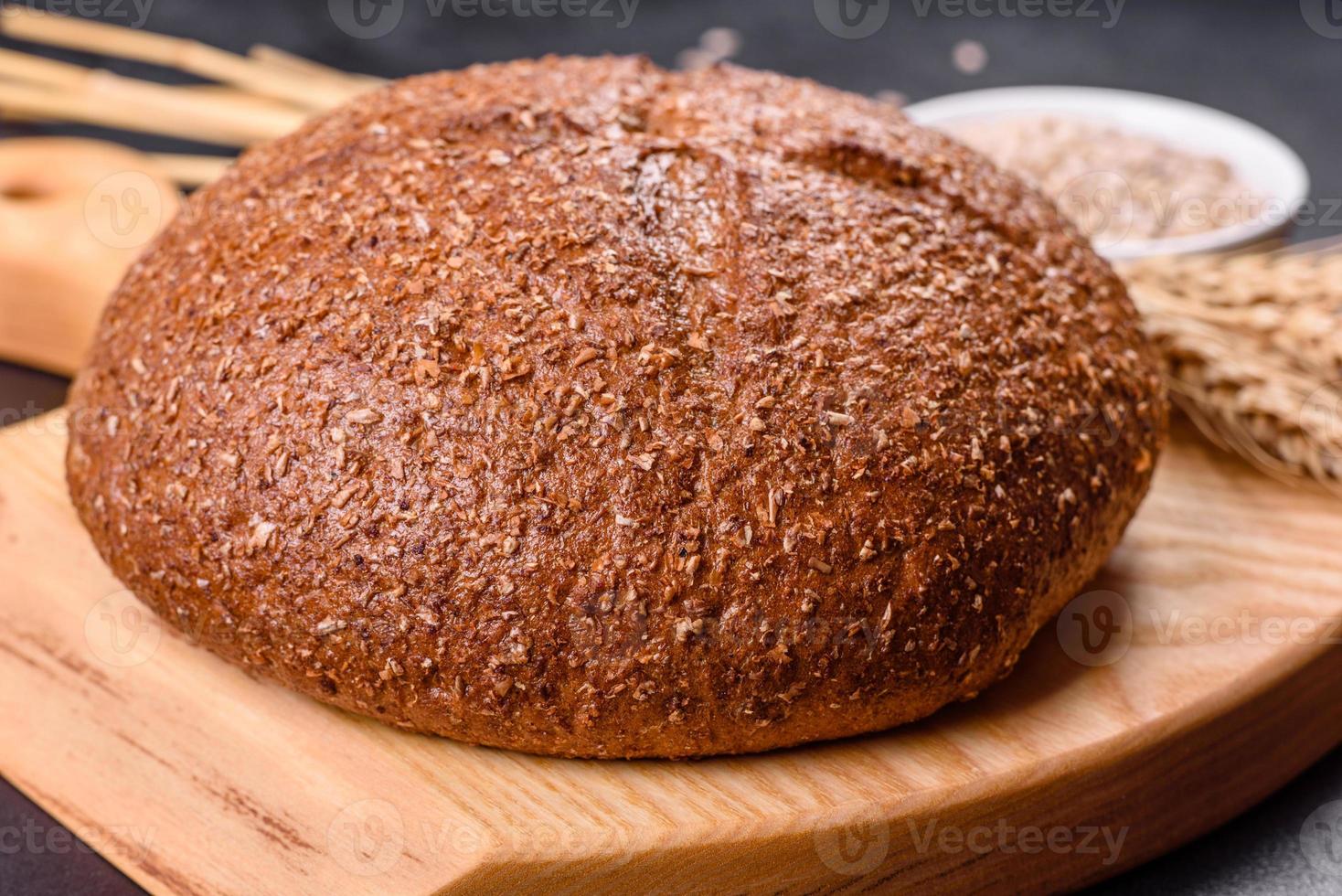 Fresh baked brown bread with ears and grains of wheat 7237320 Stock
