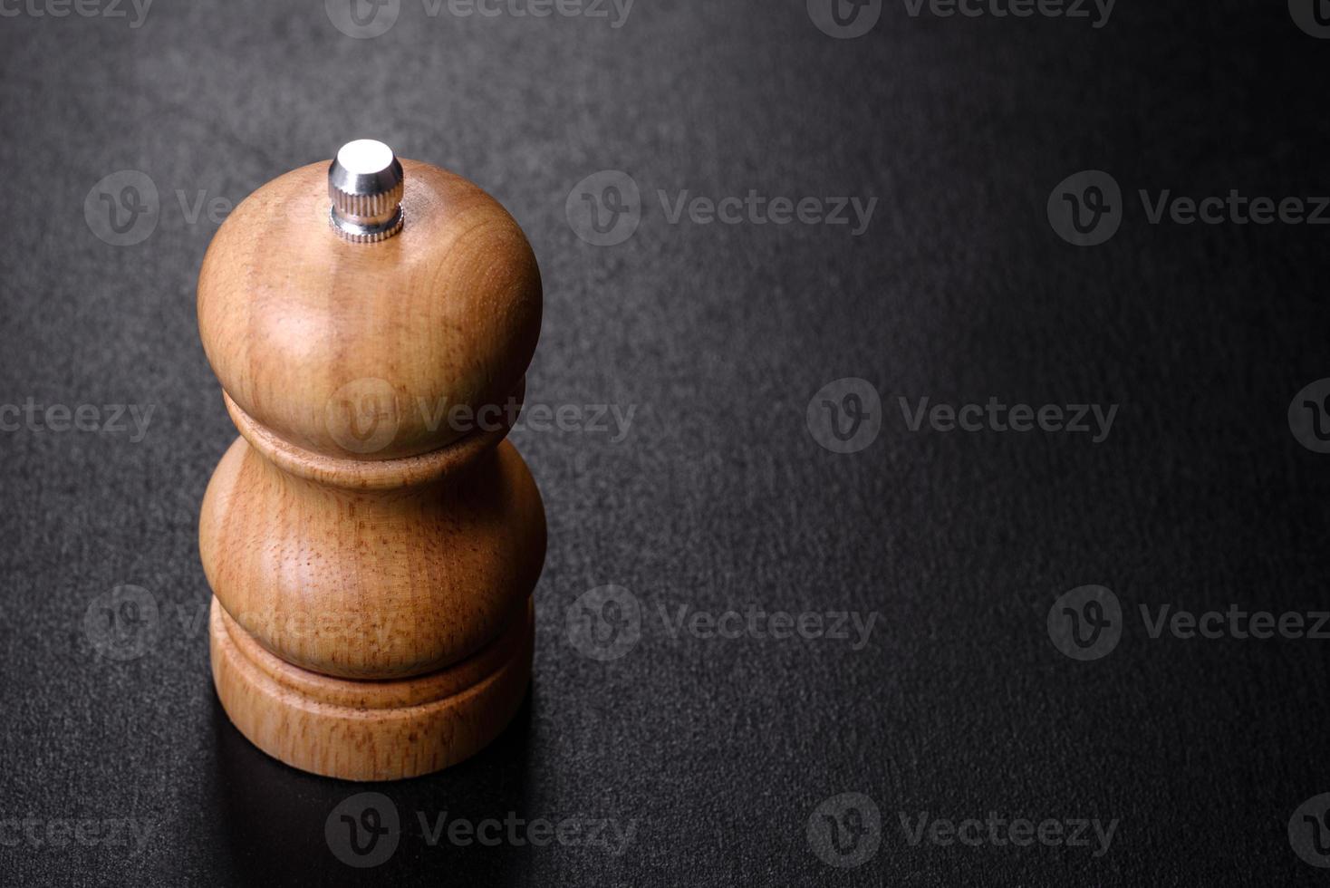 Salt or pepper shakers on black cncrete table. Space for text photo