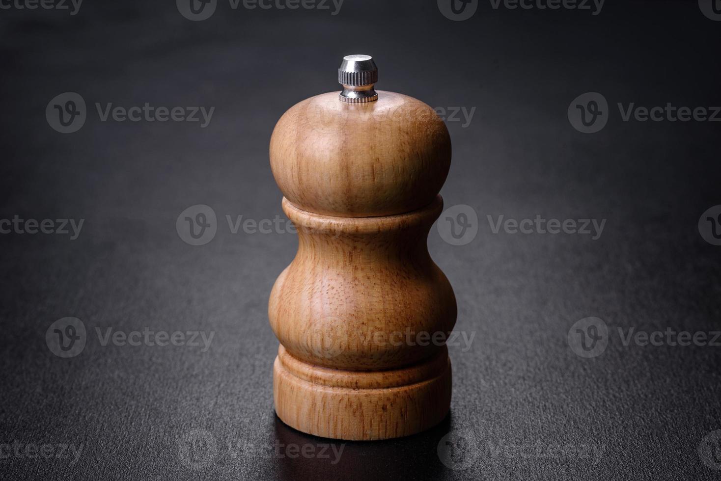 Salt or pepper shakers on black cncrete table. Space for text photo