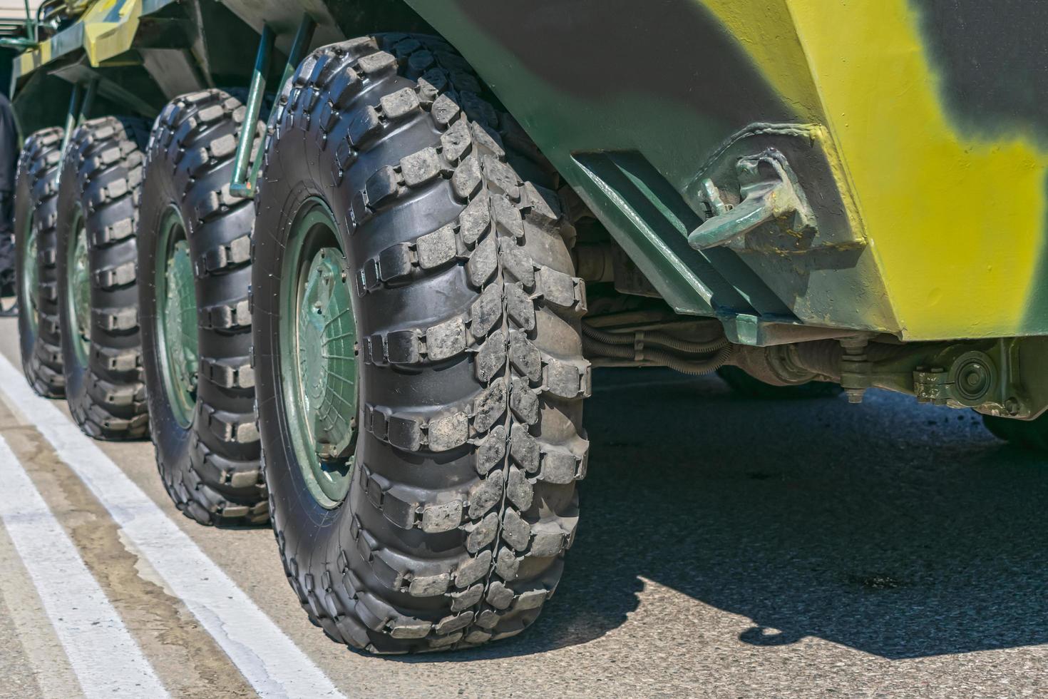 Wheels of armored vehicles in the parking lot photo