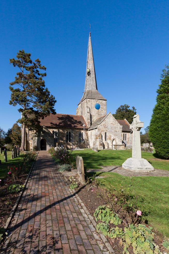 HORSTED KEYNES, SUSSEX, UK, 2009.  Steeplejack working on the church roof photo