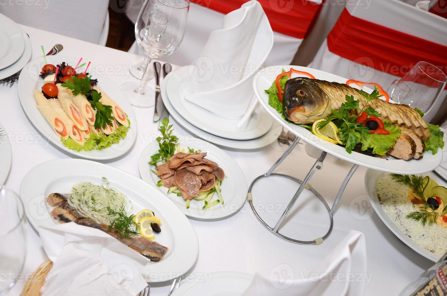 served table with crockery and food photo