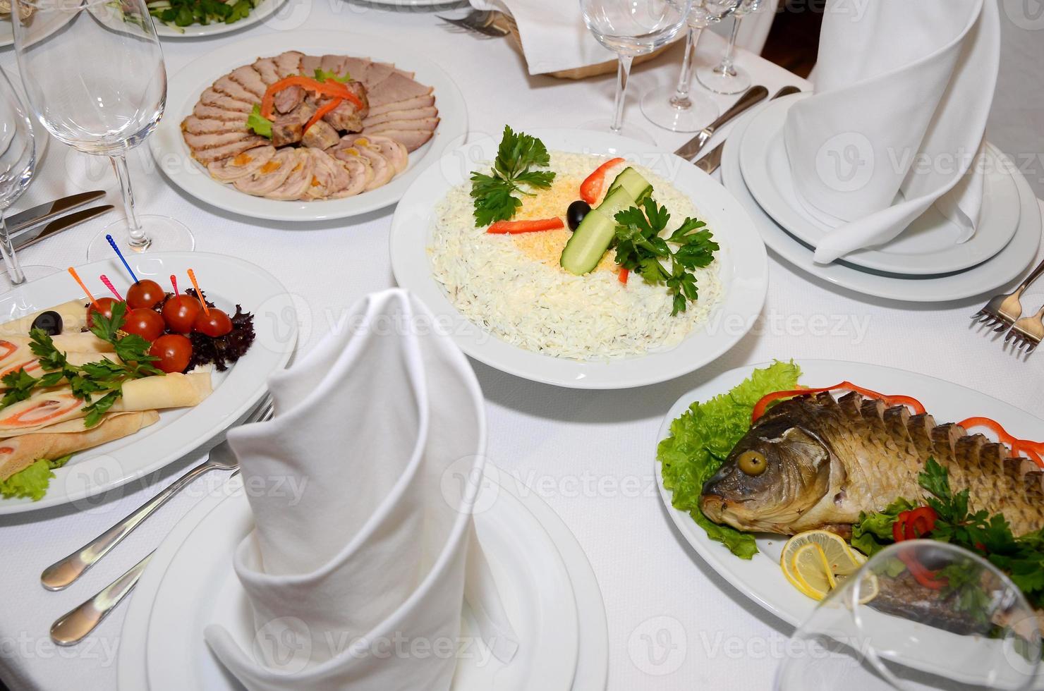 served table with crockery and food photo