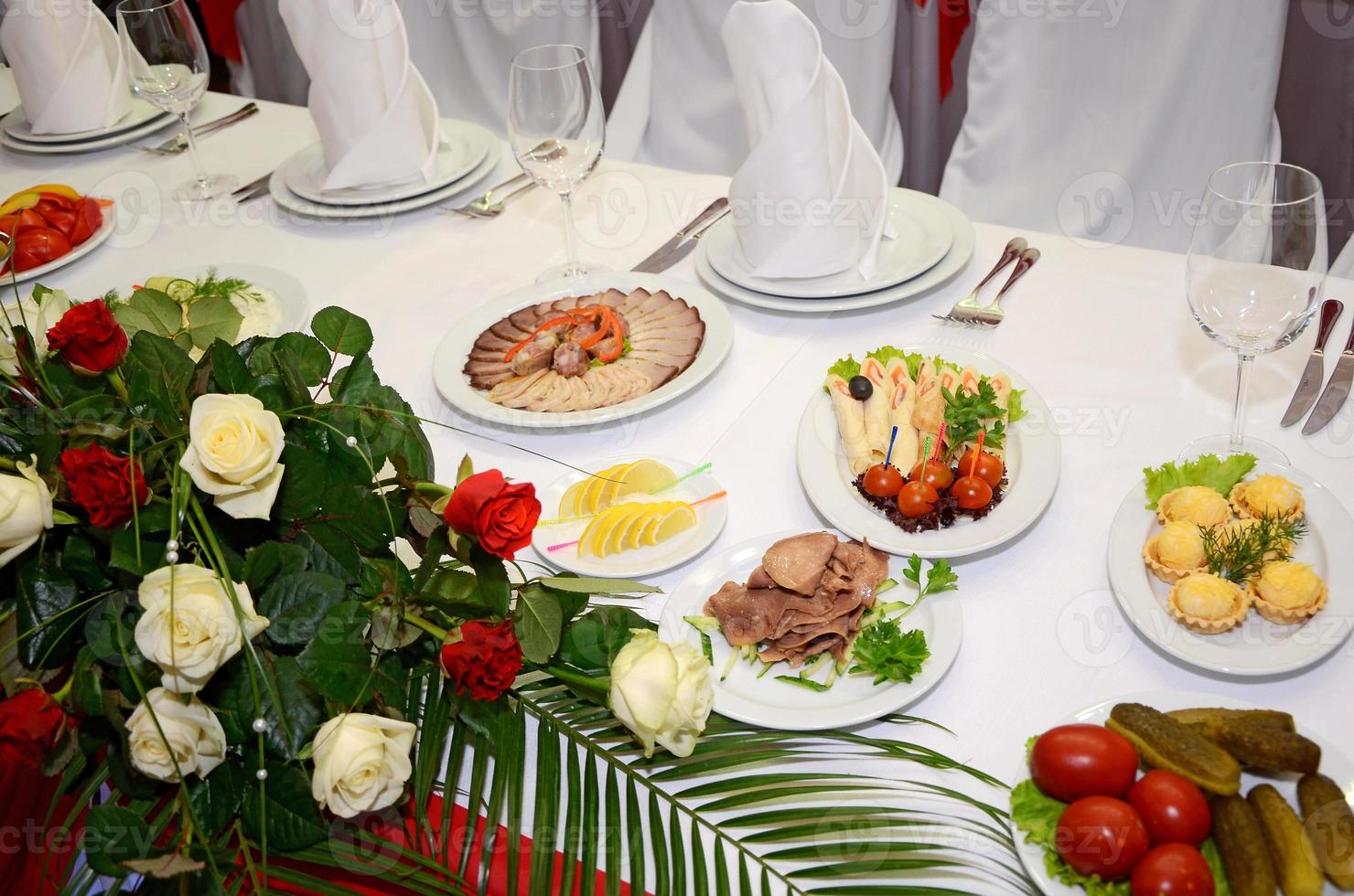 served table with crockery and food photo