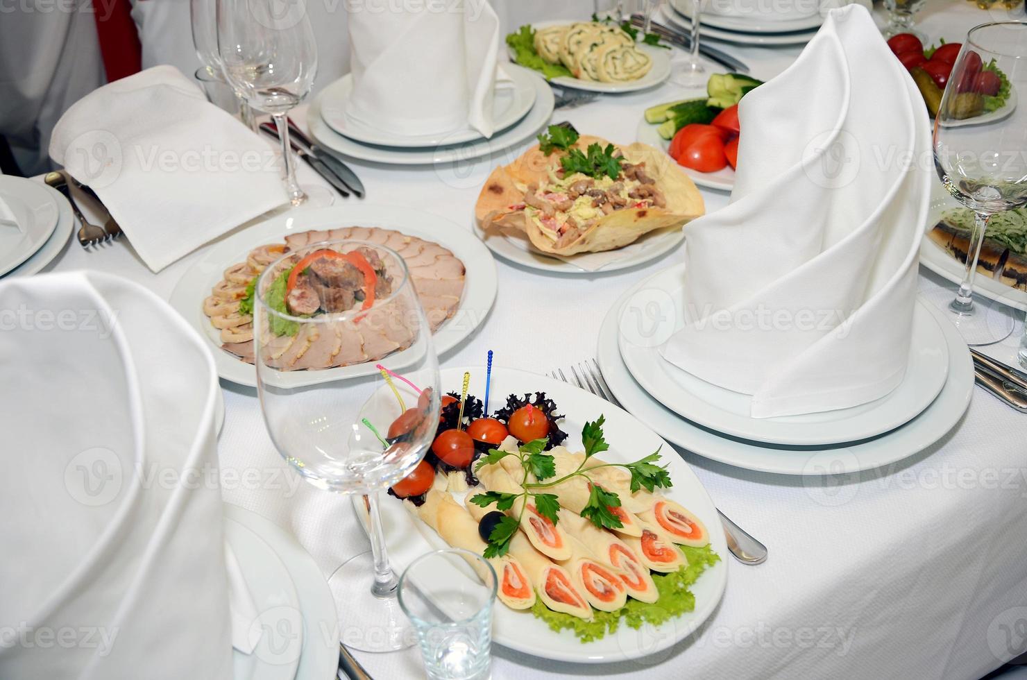 served table with crockery and food photo