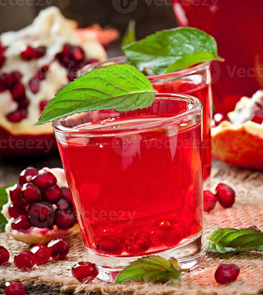 Fresh ripe pomegranate and juice photo