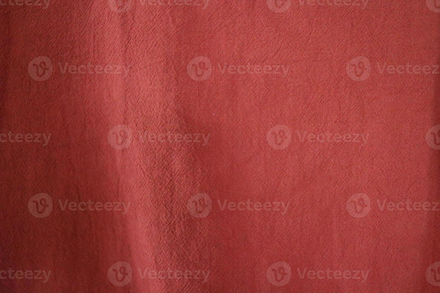 Dark red textile background, cotton fiber cloth. photo