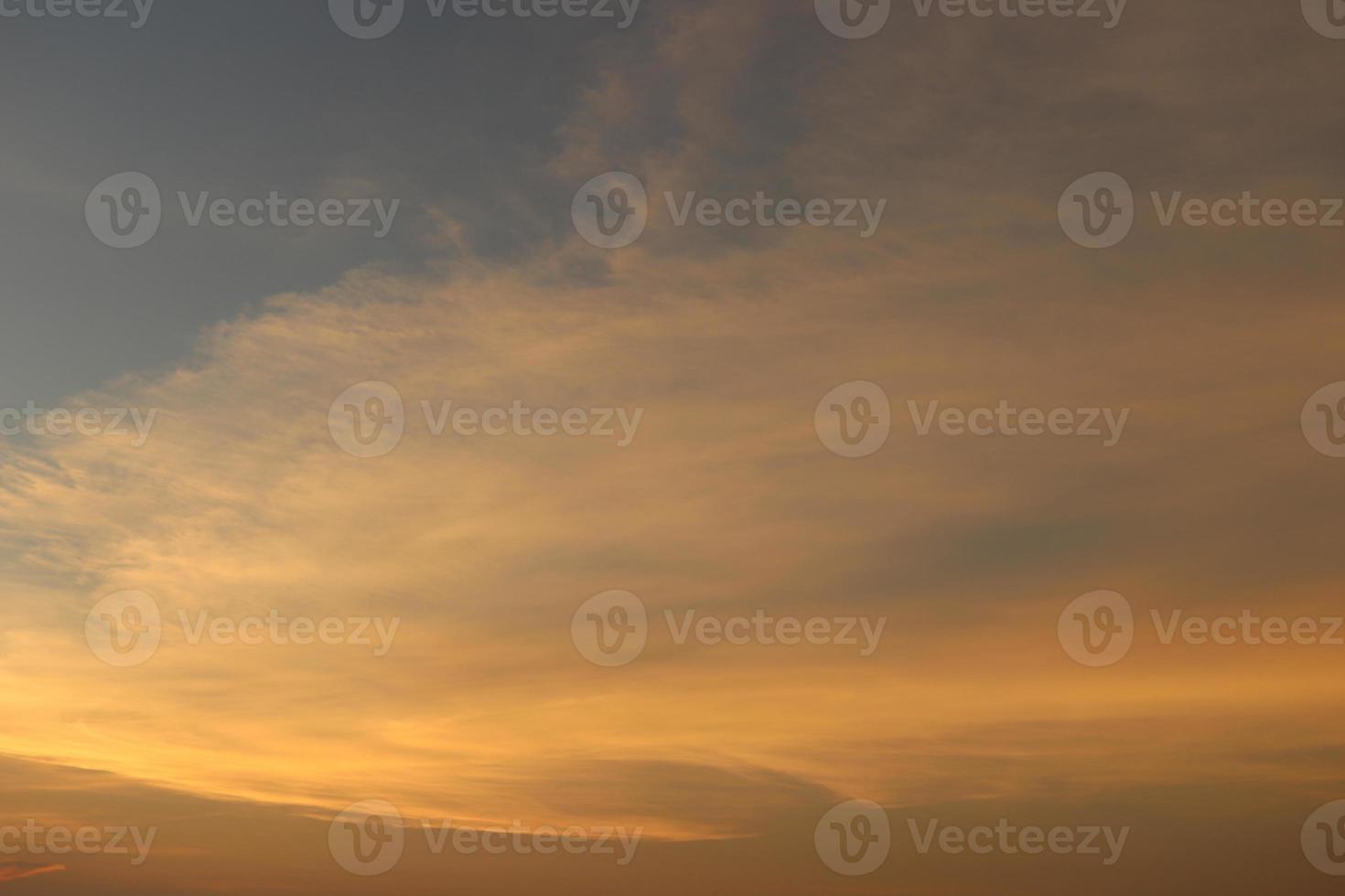Evening sky background, orange sun light on soft cloud. photo