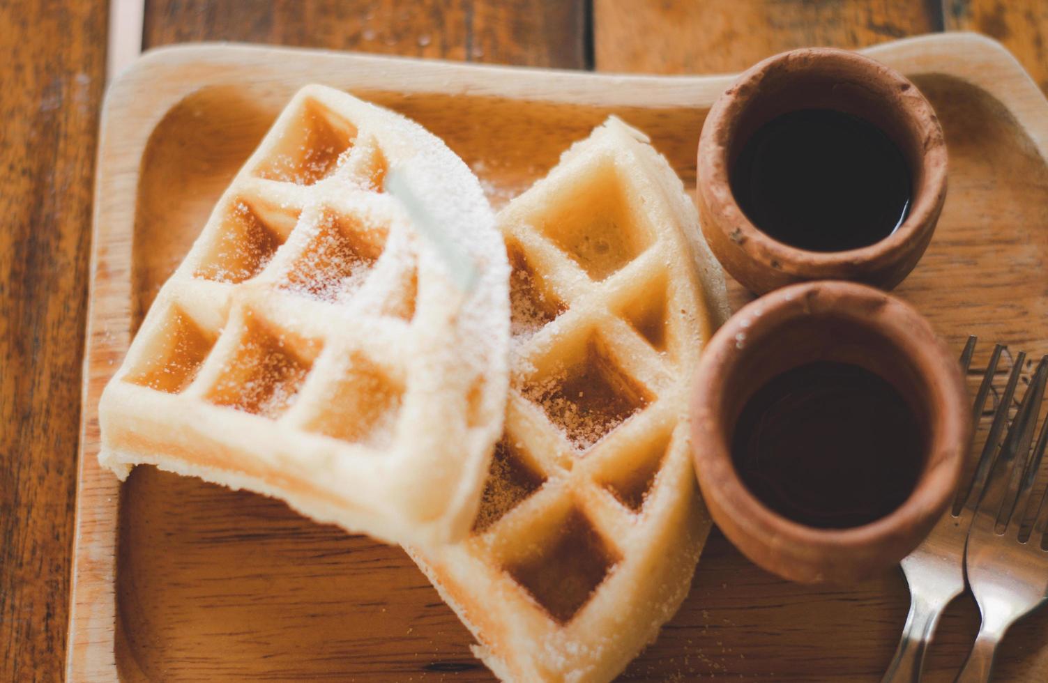 Homemade Belgium waffles served on a plate. photo