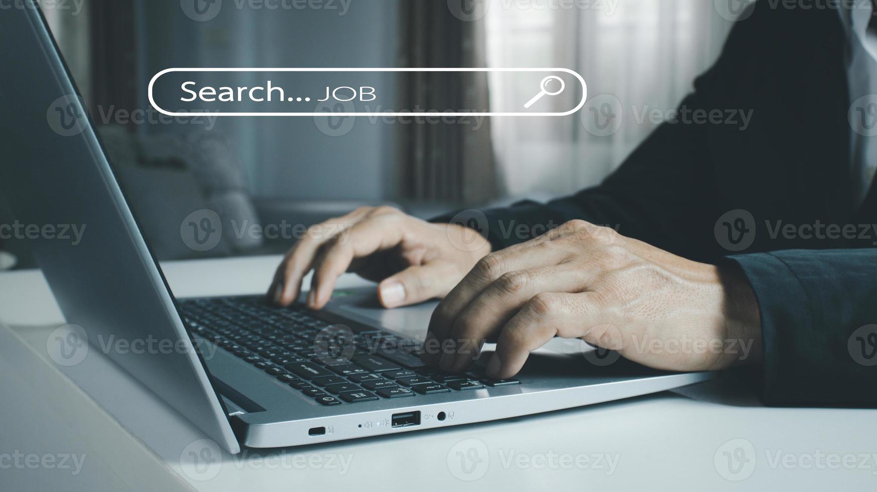 The human hand is using a computer keyboard to find information using Search Console with your website. photo