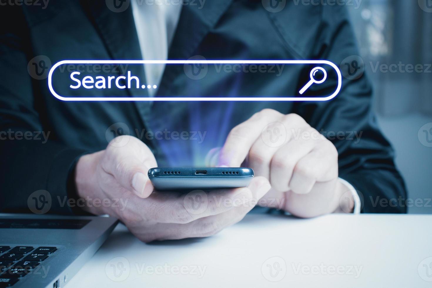 man touching mobile phone screen with finger To  search information from modern technology networks. photo